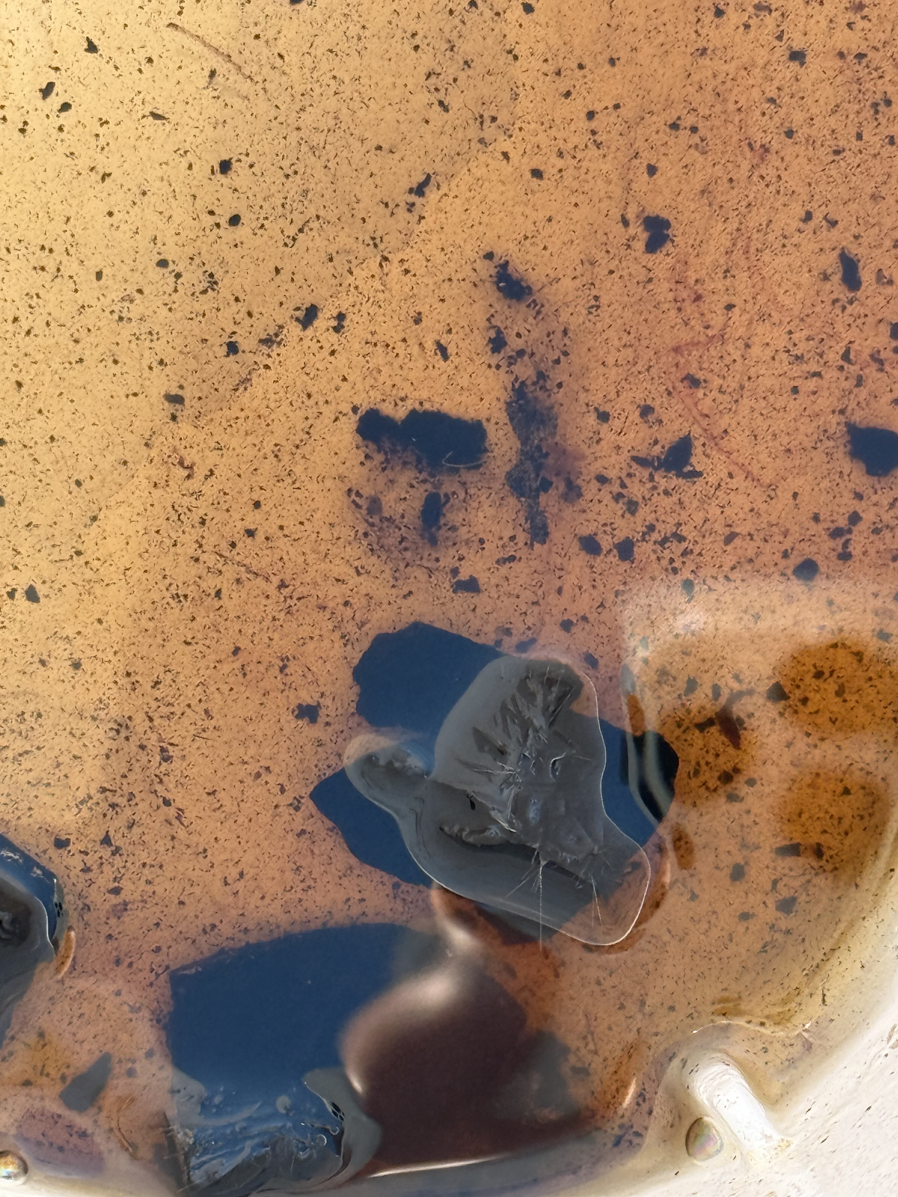 Brown-black in mineral spirits may indicate asphalt while yellow-green may indicate coal