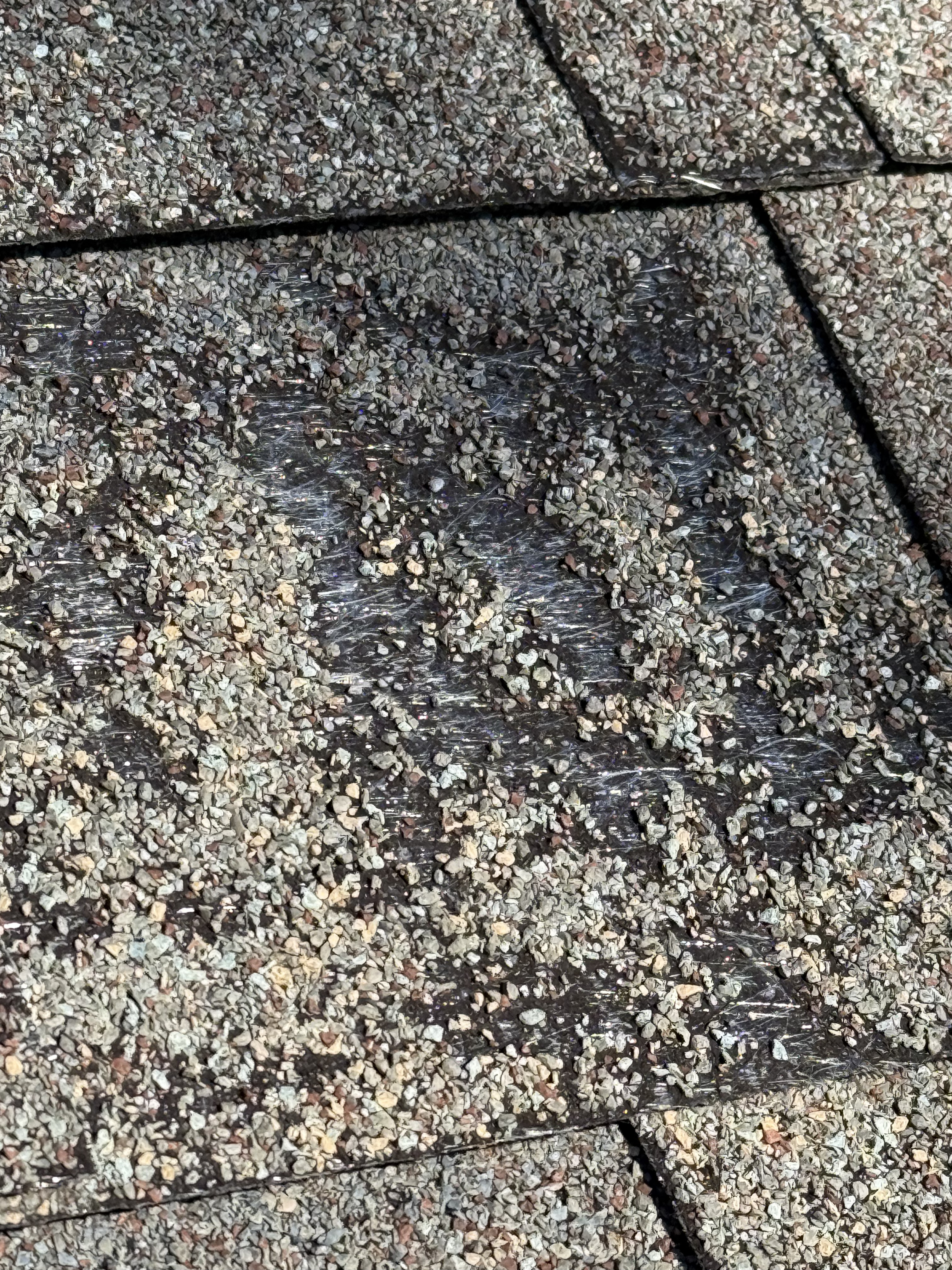 Close up of likely defect in shingle manufacturing